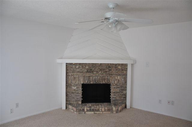 5630 Spring Valley Road, Unit 19B Dallas, TX 75254 - Photo 15 of 25 an empty room with a fireplace