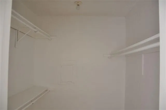 a view of a swimming pool with a yard