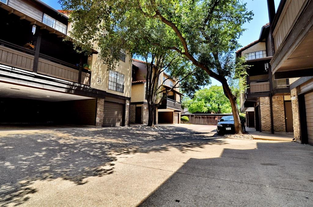 5630 Spring Valley Road, Unit 19B Dallas, TX 75254 - Photo 23 of 25 a view of a building with a outdoor space