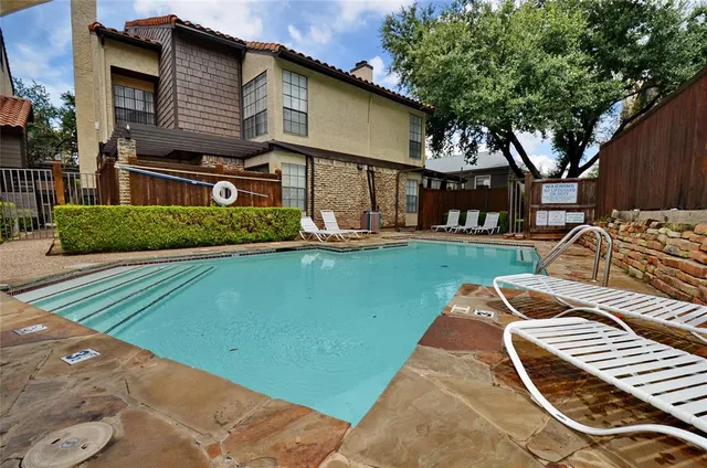 a view of a house with backyard porch and sitting area