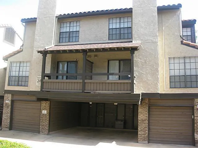 a front view of a house with barbeque
