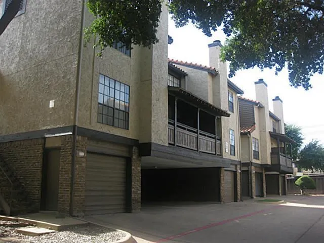 a view of a house with a door and wooden floor