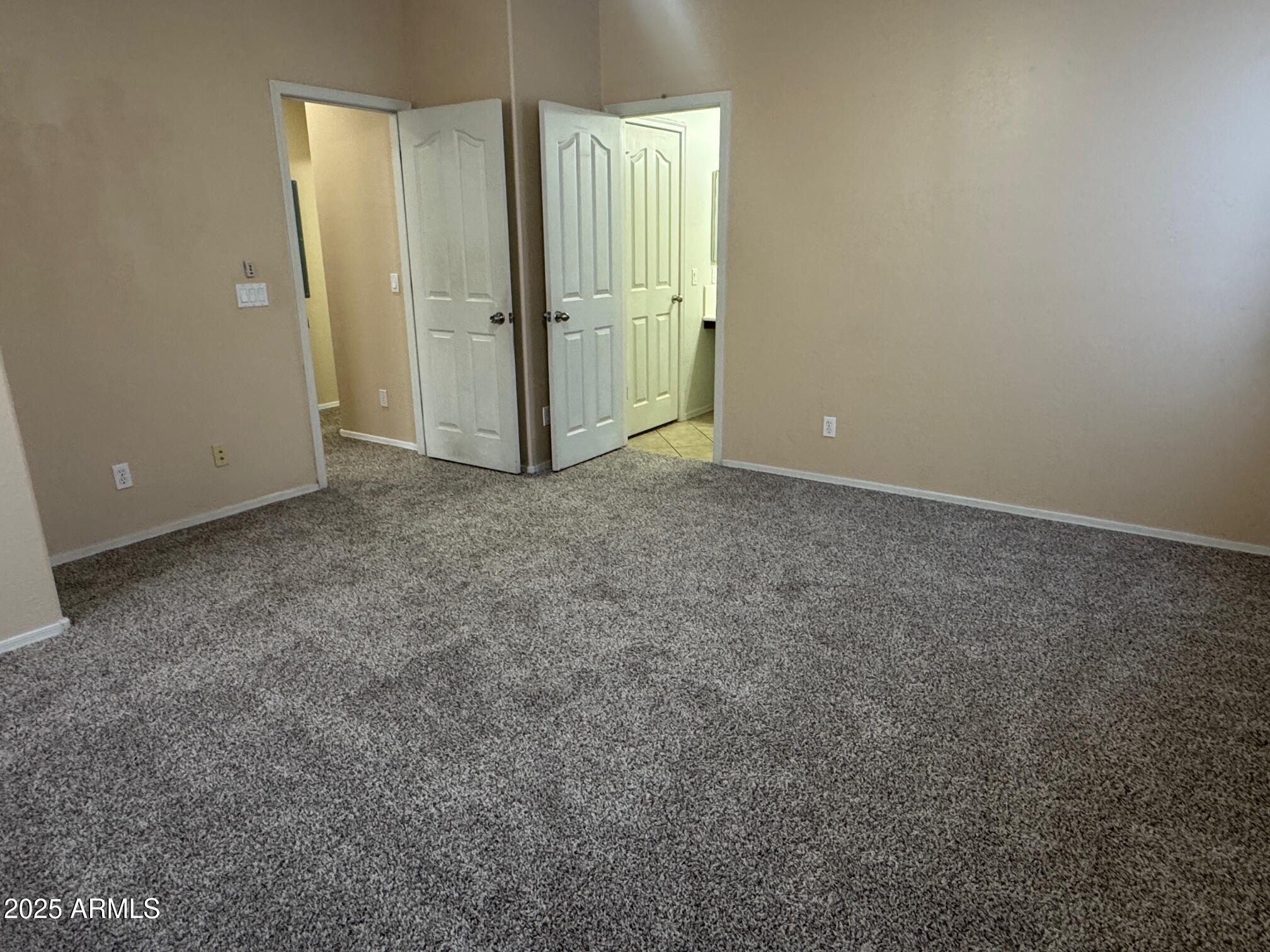 8105 West Groom Creek Road Phoenix, AZ 85043 - Photo 11 of 13 an empty room with closet area