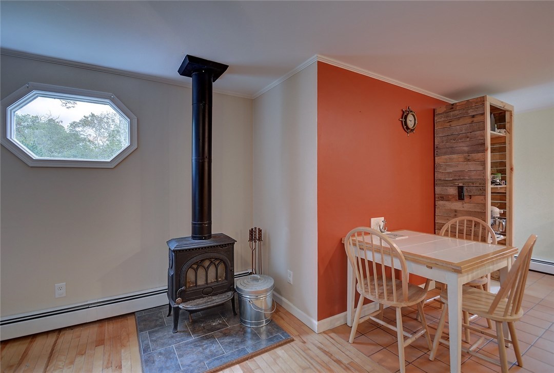 420 Gardiner Road Richmond, RI 02892 - Photo 6 of 33 Wood Stove and dining area