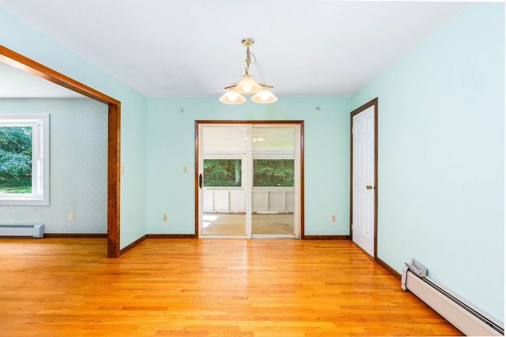 135 Blake Corner Road Phillipston, MA 01331 - Photo 14 of 42 a view of an empty room with window and wooden floor