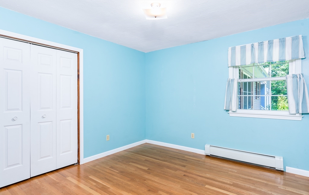 135 Blake Corner Road Phillipston, MA 01331 - Photo 19 of 42 a view of a room with wooden floor and windows