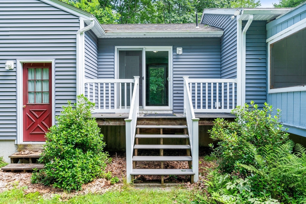 135 Blake Corner Road Phillipston, MA 01331 - Photo 32 of 42 a backyard of a house with deck and furniture