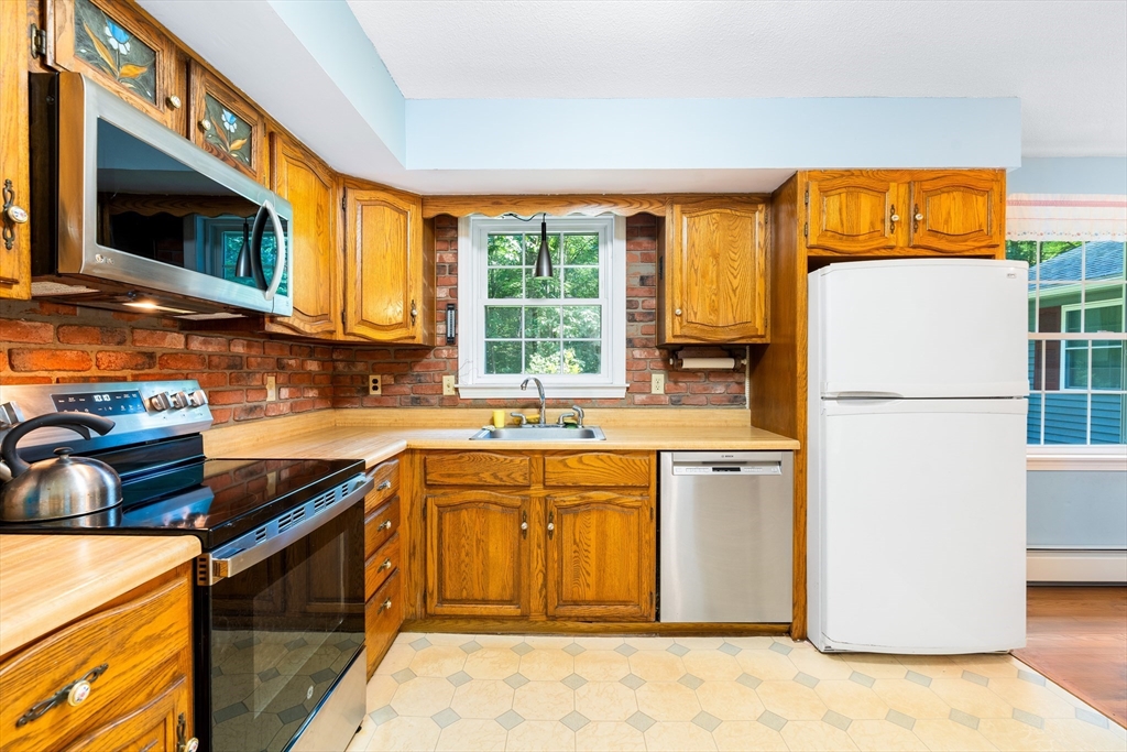135 Blake Corner Road Phillipston, MA 01331 - Photo 4 of 42 a kitchen with stainless steel appliances granite countertop a refrigerator stove top oven a sink and dishwasher