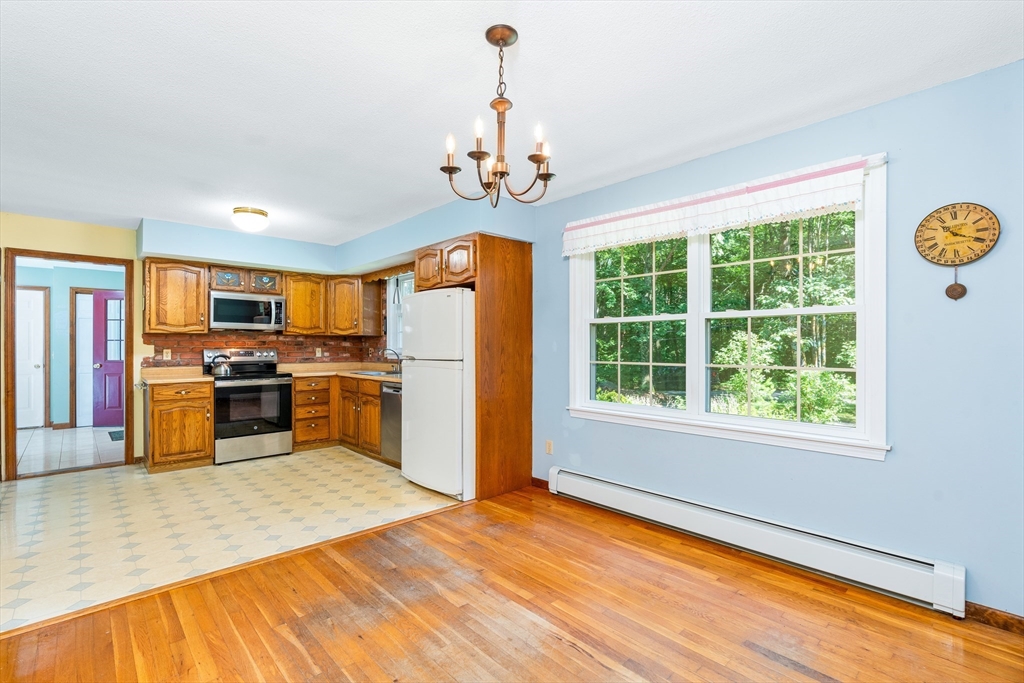 135 Blake Corner Road Phillipston, MA 01331 - Photo 6 of 42 a kitchen with stainless steel appliances granite countertop a stove and a refrigerator