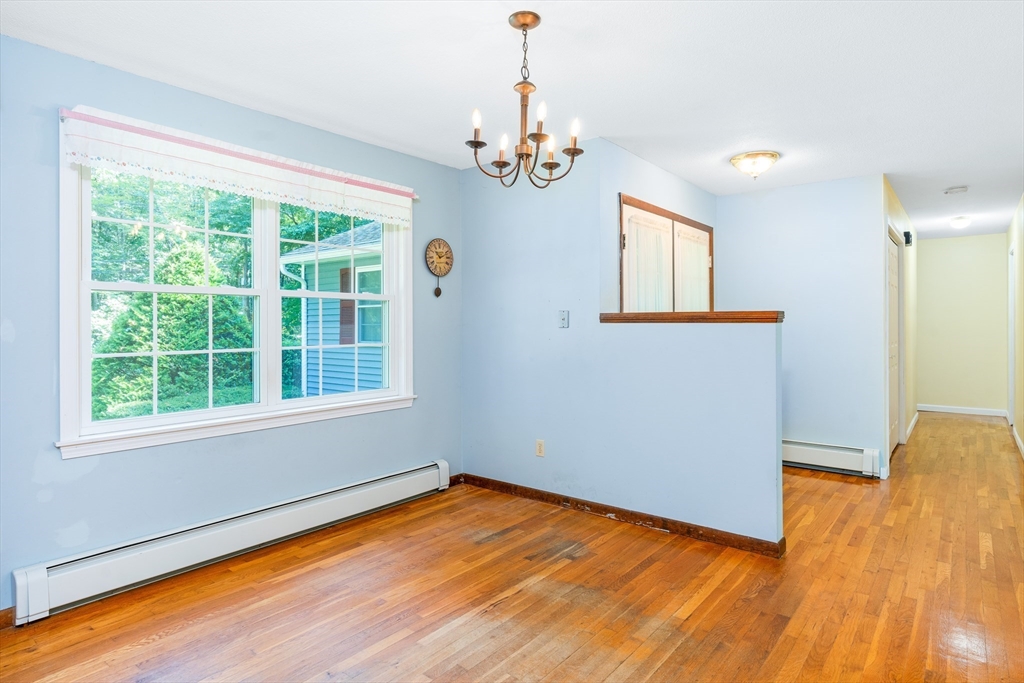 135 Blake Corner Road Phillipston, MA 01331 - Photo 7 of 42 a view of empty room with wooden floor and fan