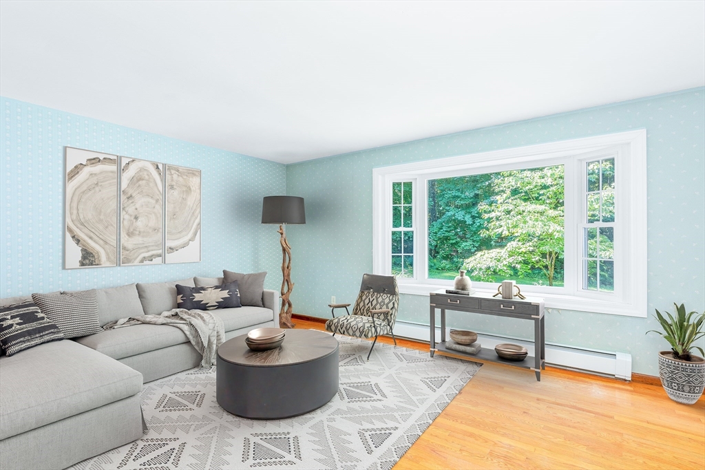135 Blake Corner Road Phillipston, MA 01331 - Photo 10 of 42 a living room with furniture and a large window