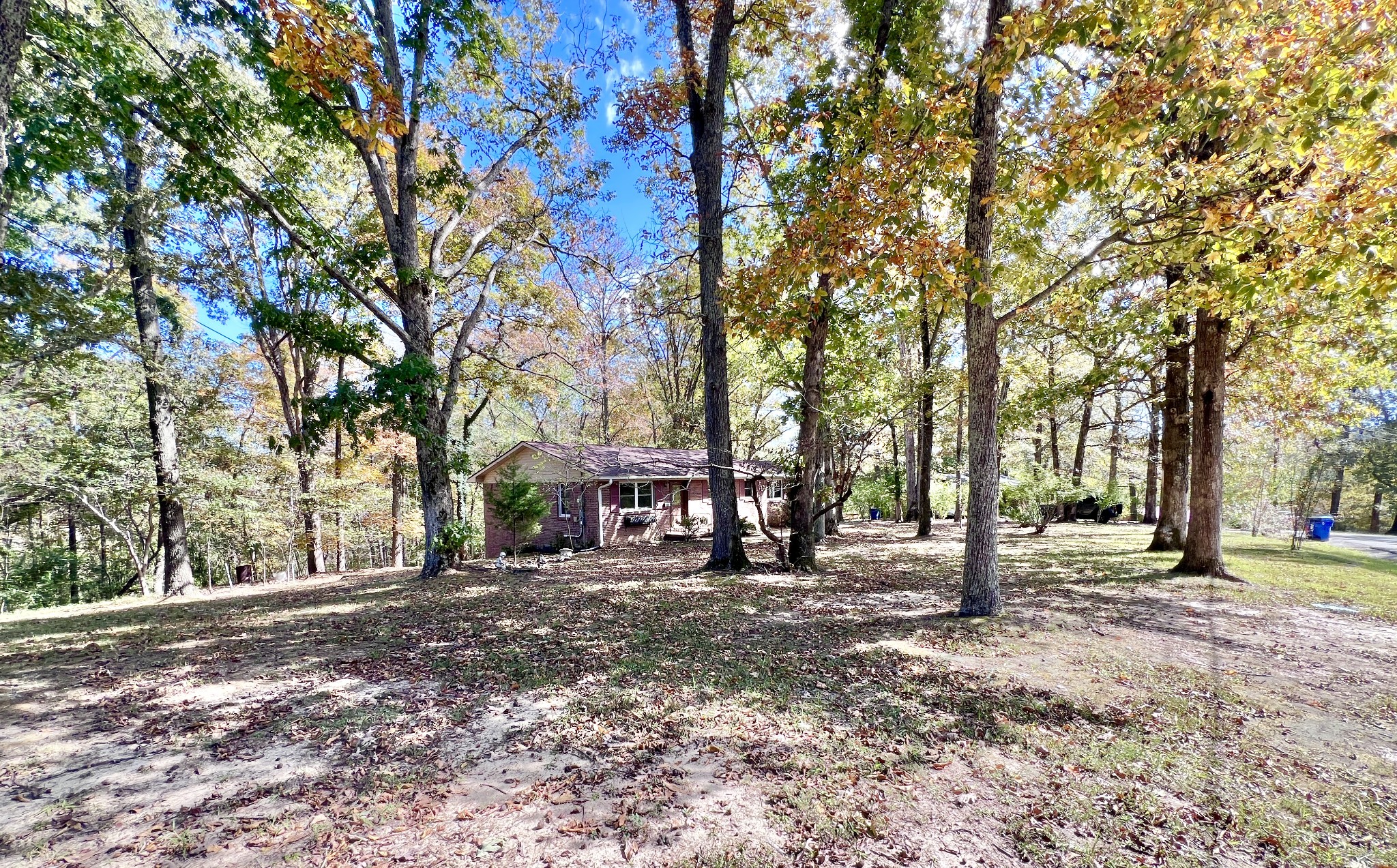 329 Valley View Road Dover, TN 37058 - Photo 11 of 35 a view of a yard with a house in the background
