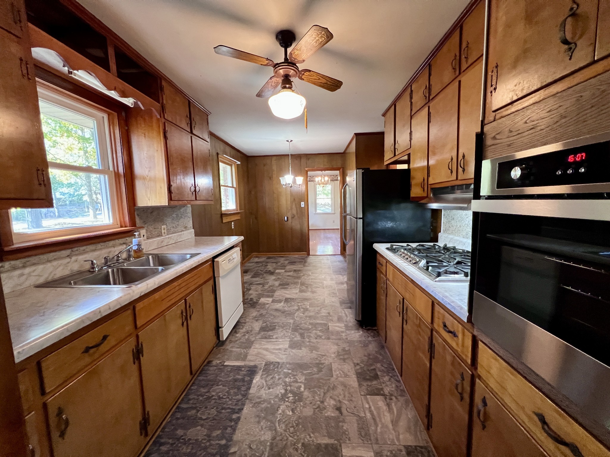 329 Valley View Road Dover, TN 37058 - Photo 18 of 35 a large kitchen with stainless steel appliances granite countertop a sink stove and refrigerator