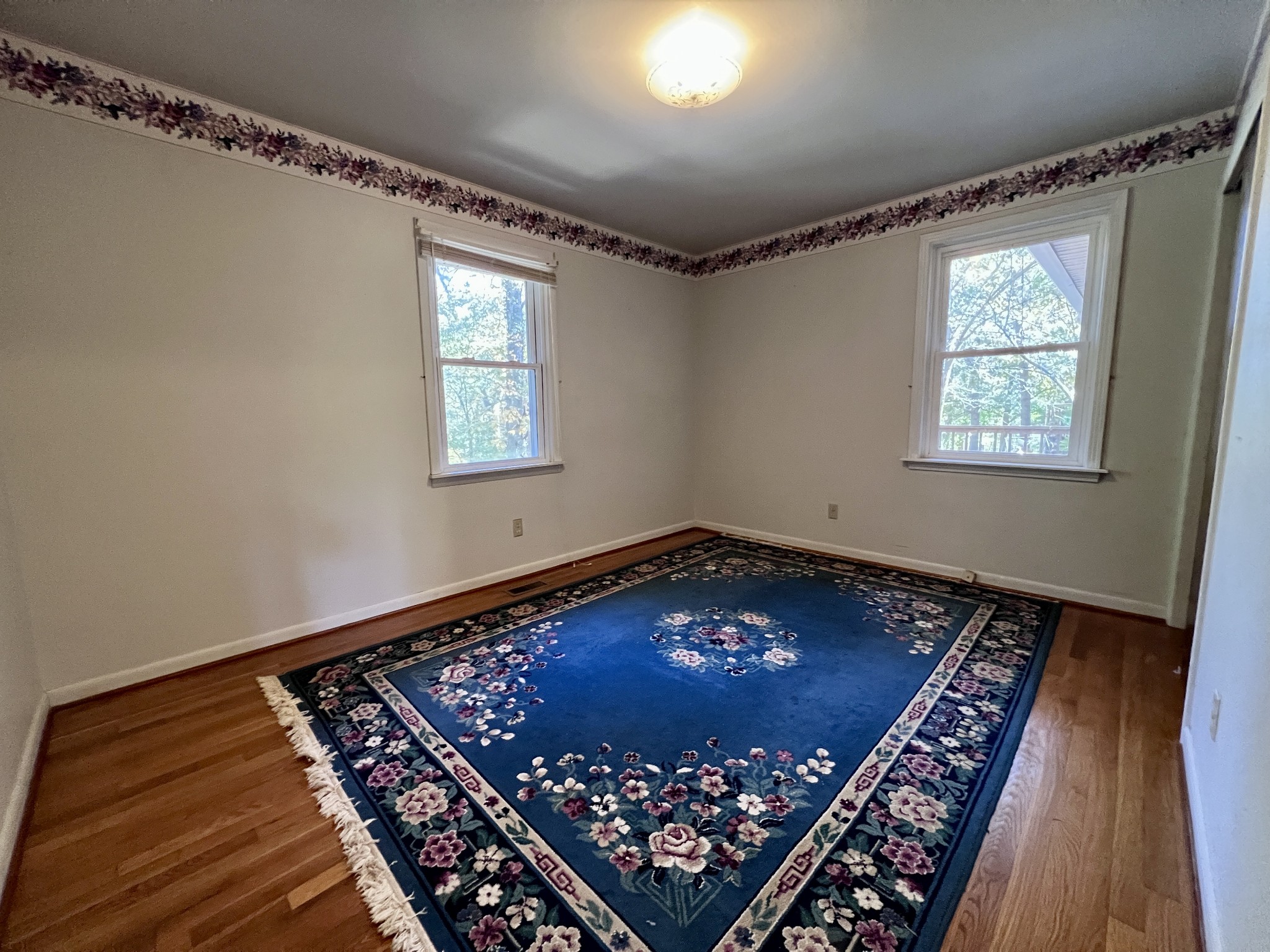 329 Valley View Road Dover, TN 37058 - Photo 27 of 35 a view of an empty room with window and wooden floor