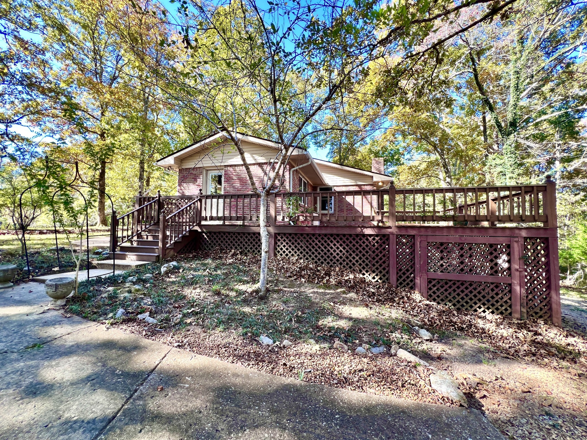 329 Valley View Road Dover, TN 37058 - Photo 3 of 35 a house that has a tree in front of it