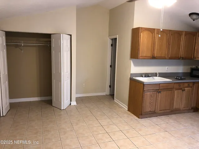 a view of a kitchen with cabinets