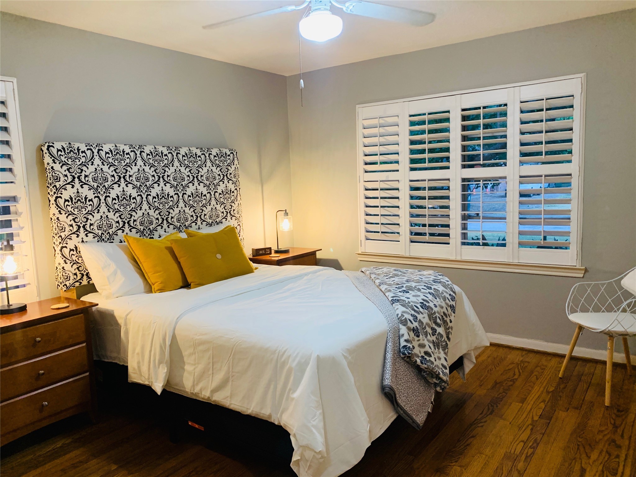 9626 Long Branch Lane Houston, TX 77055 - Photo 11 of 18 a bedroom with a large bed and a chair