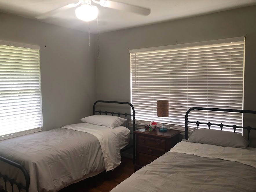 9626 Long Branch Lane Houston, TX 77055 - Photo 15 of 18 a bedroom with a bed and a large window