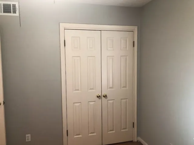 a view of a chairs and table in backyard