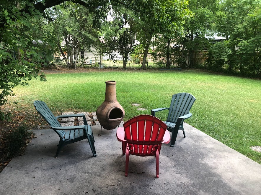 9626 Long Branch Lane Houston, TX 77055 - Photo 17 of 18 a view of a chairs and table in backyard