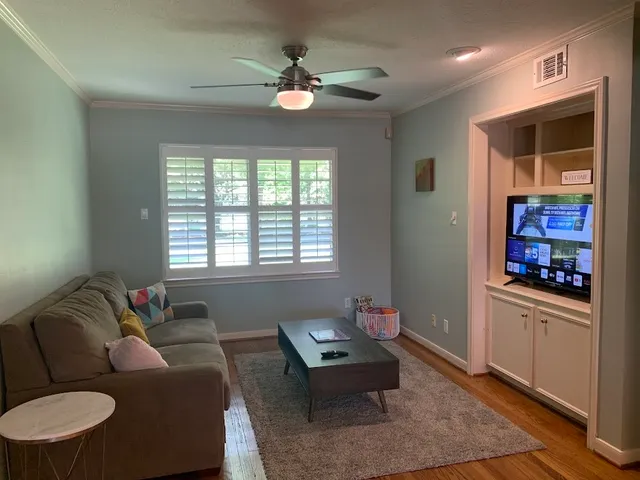 a living room with furniture and a window