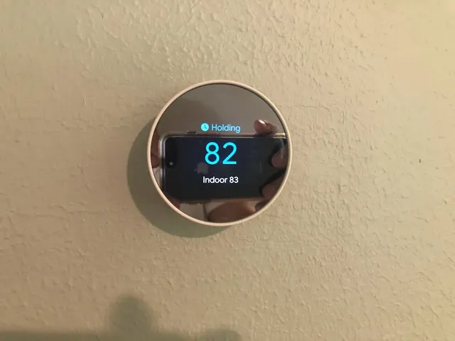 a bedroom with a large bed and a chair