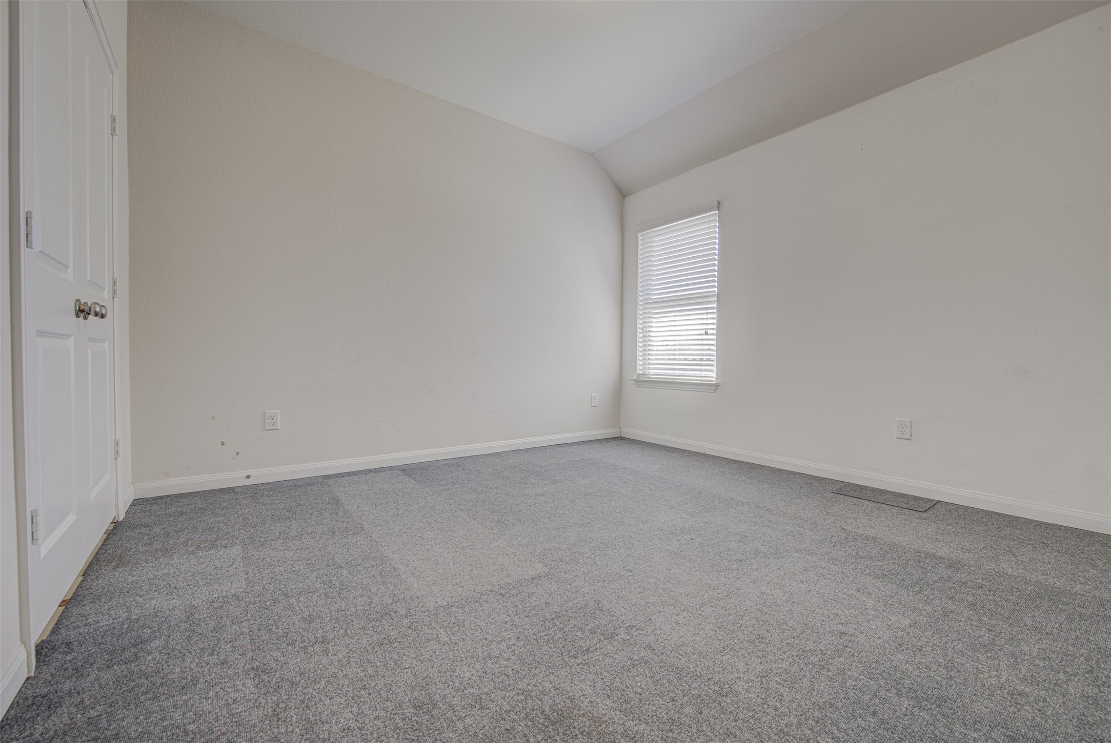 413 Pinnacle View Drive Georgetown, TX 78628 - Photo 12 of 31 Empty room with carpet floors and vaulted ceiling