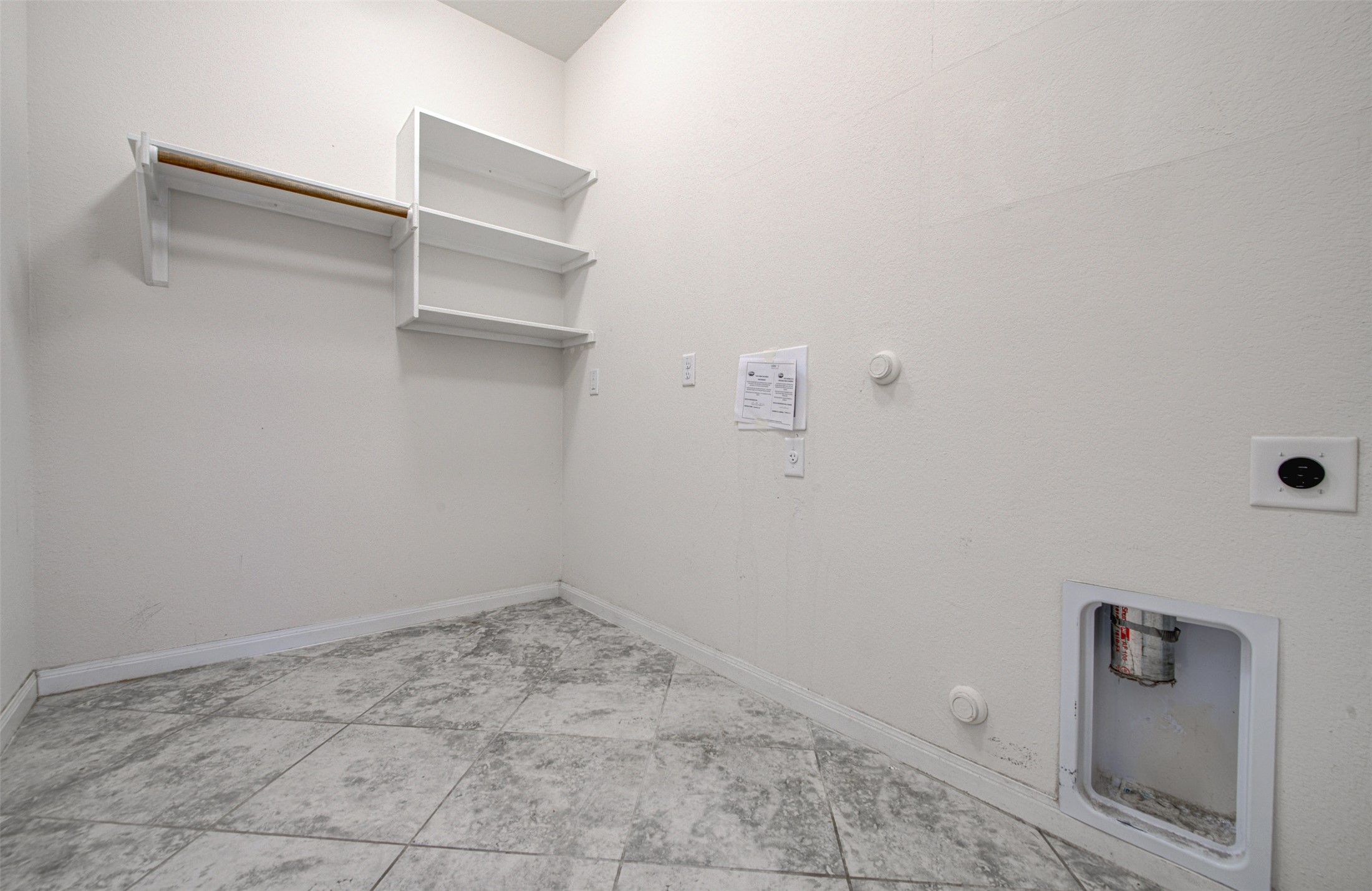 413 Pinnacle View Drive Georgetown, TX 78628 - Photo 17 of 31 Laundry room featuring gas dryer hookup, light tile patterned flooring, and electric dryer hookup