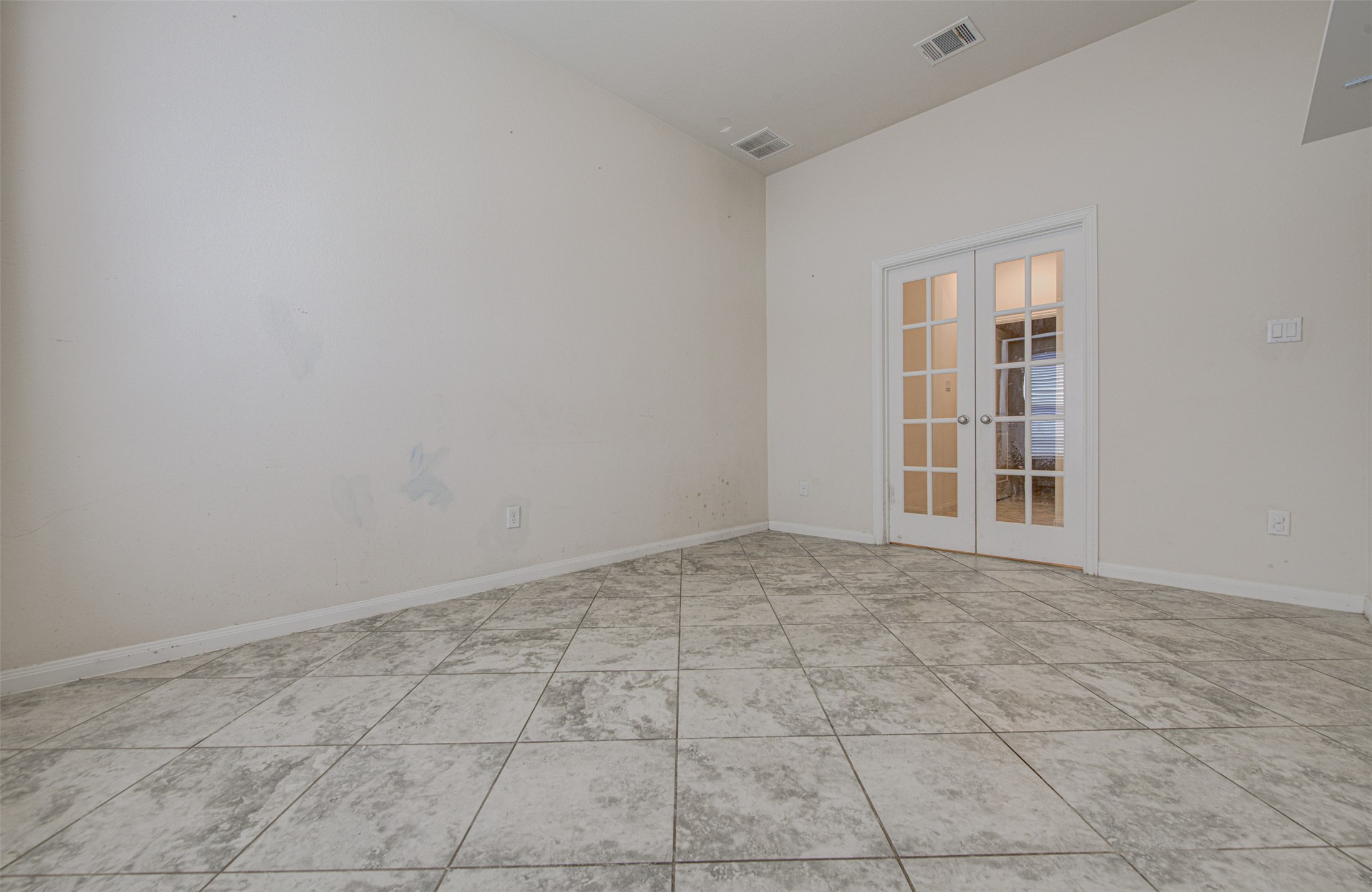 413 Pinnacle View Drive Georgetown, TX 78628 - Photo 19 of 31 Empty room with french doors and light tile patterned floors