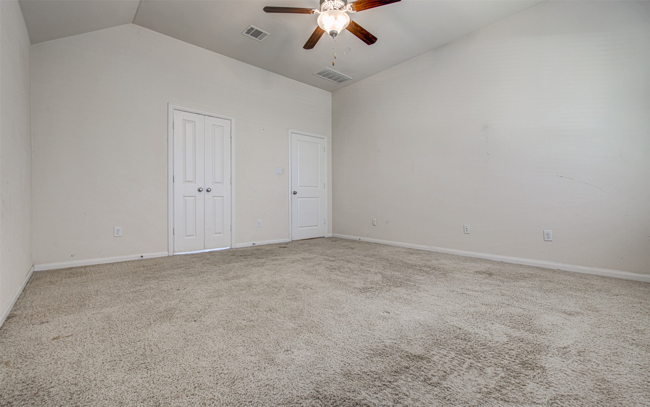 413 Pinnacle View Drive Georgetown, TX 78628 - Photo 23 of 31 Unfurnished bedroom with carpet, a ceiling fan, a closet, and a high ceiling