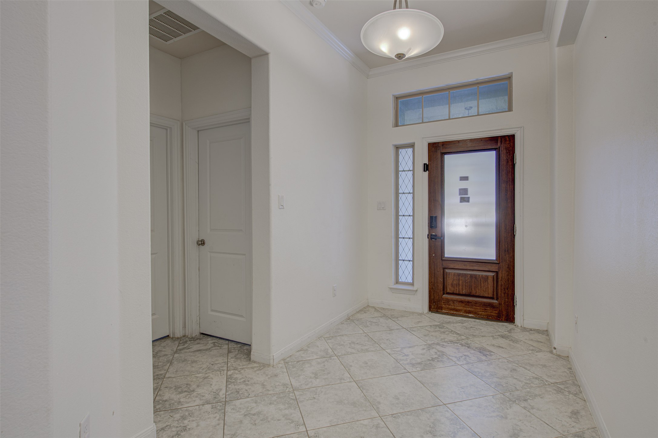 413 Pinnacle View Drive Georgetown, TX 78628 - Photo 5 of 31 Entryway featuring crown molding and baseboards
