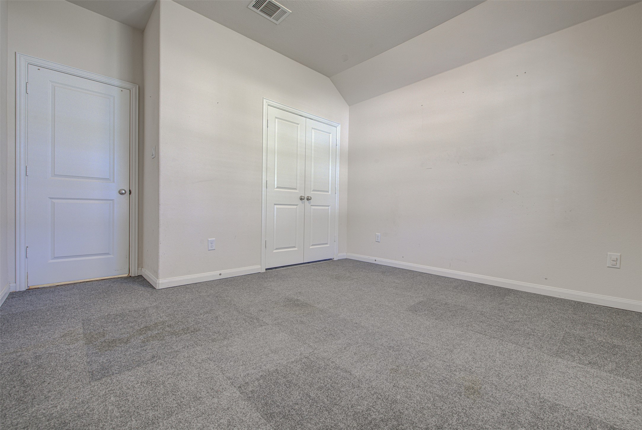 413 Pinnacle View Drive Georgetown, TX 78628 - Photo 10 of 31 Unfurnished bedroom with carpet floors, lofted ceiling, and a closet