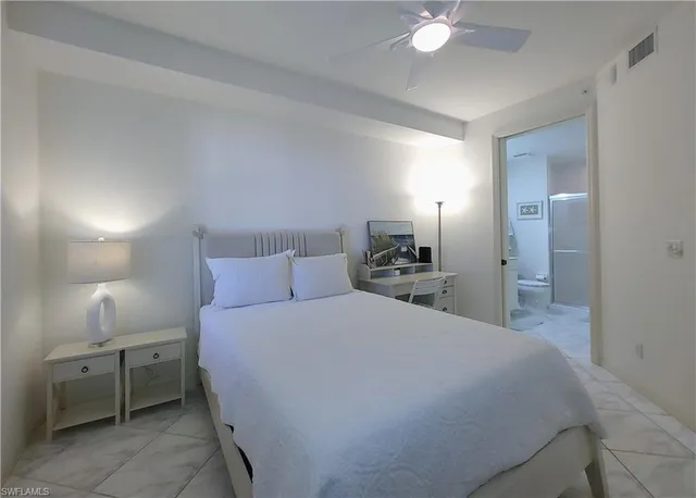 a bathroom with a toilet sink and shower