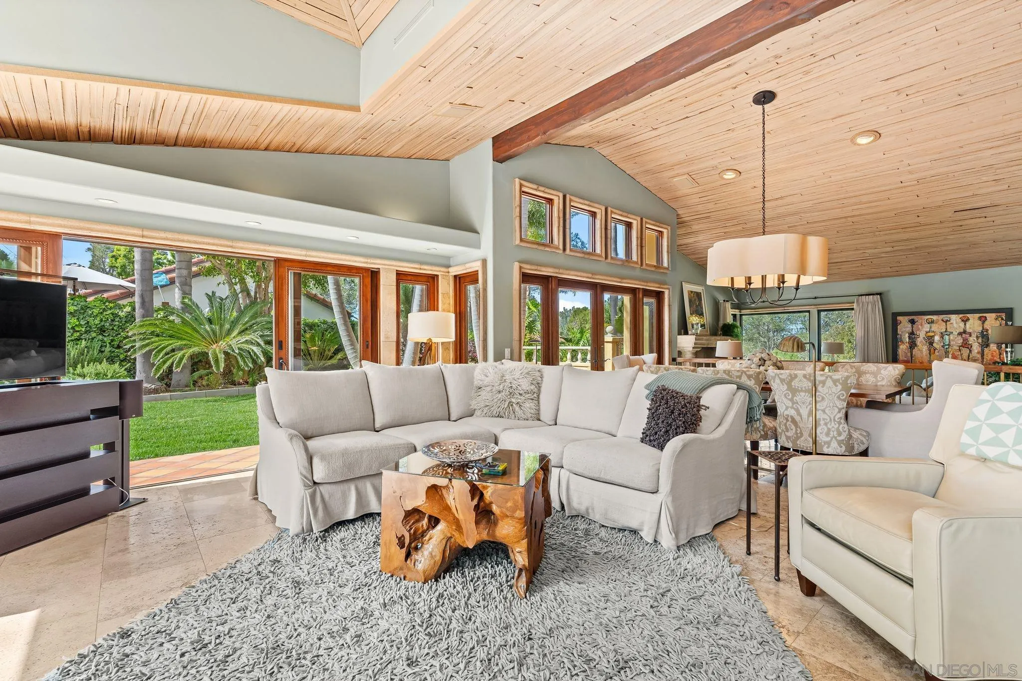 2969 Racetrack View Drive Del Mar, CA 92014 - Photo 13 of 74 a living room with furniture and a chandelier