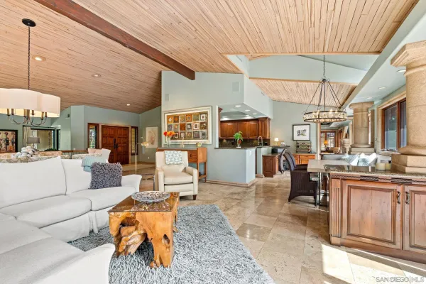 a bathroom with a granite countertop sink a toilet a mirror and shower