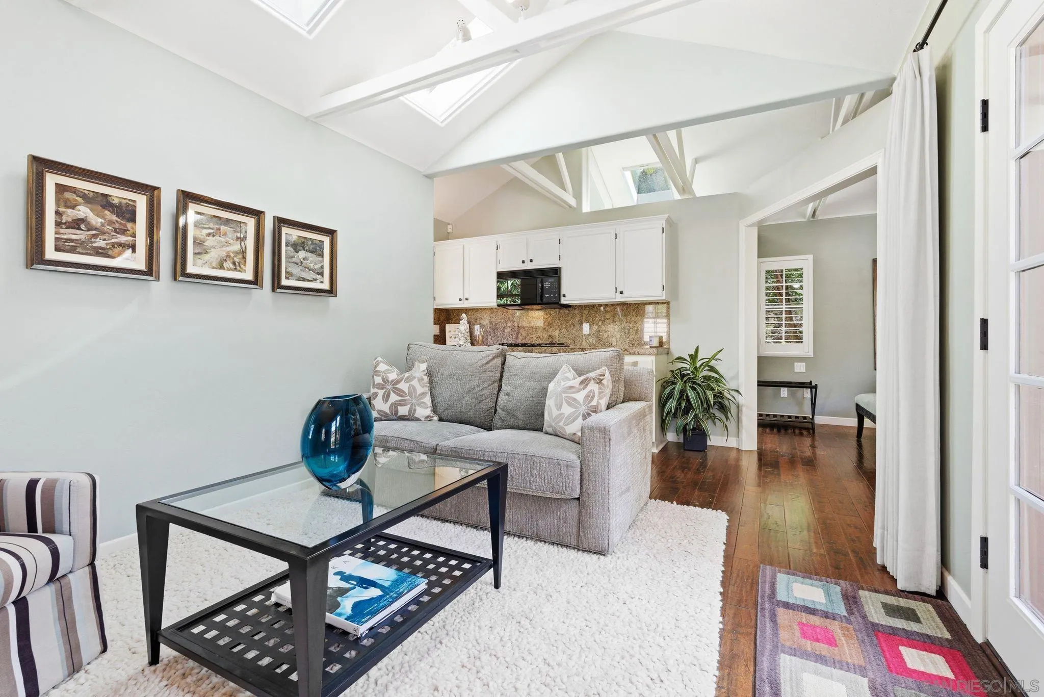 2969 Racetrack View Drive Del Mar, CA 92014 - Photo 63 of 74 a living room with furniture and a dining table with wooden floor