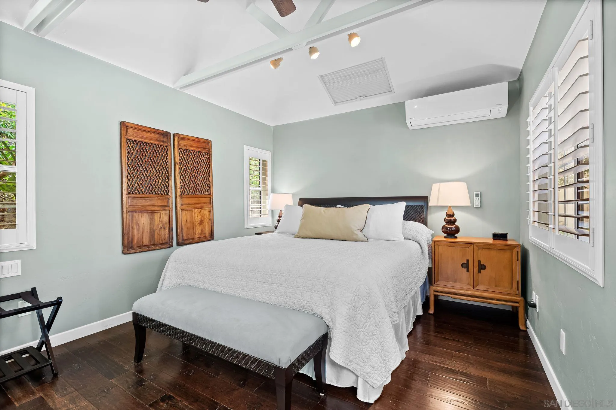 2969 Racetrack View Drive Del Mar, CA 92014 - Photo 67 of 74 a bedroom with a bed and wooden floor