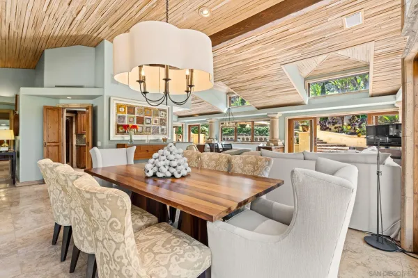a spacious bathroom with a granite countertop sink a large mirror and a bathtub