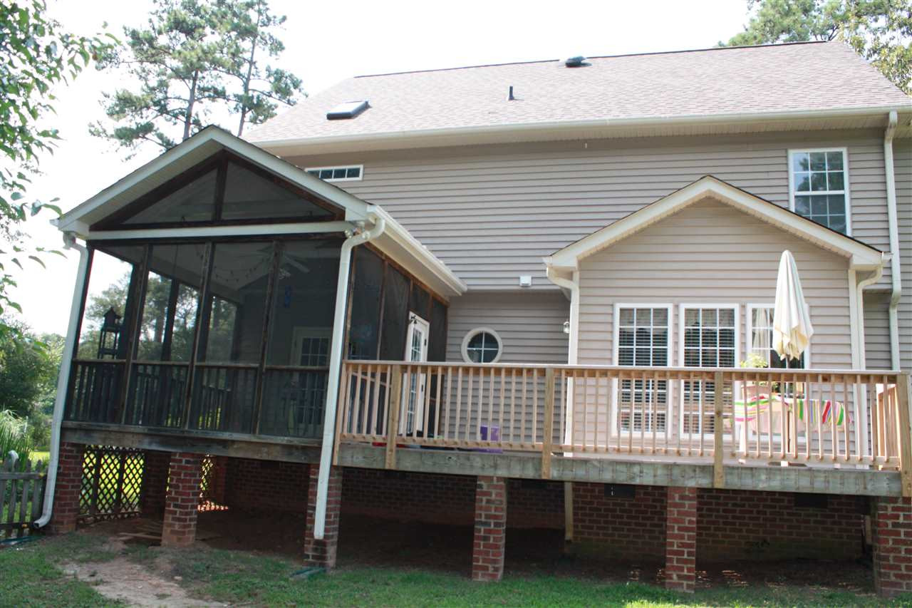 921 Elbridge Drive Raleigh, NC 27603 - Photo 25 of 28 Morning cup of coffee on the deck or on the screened in porch Exterior Back