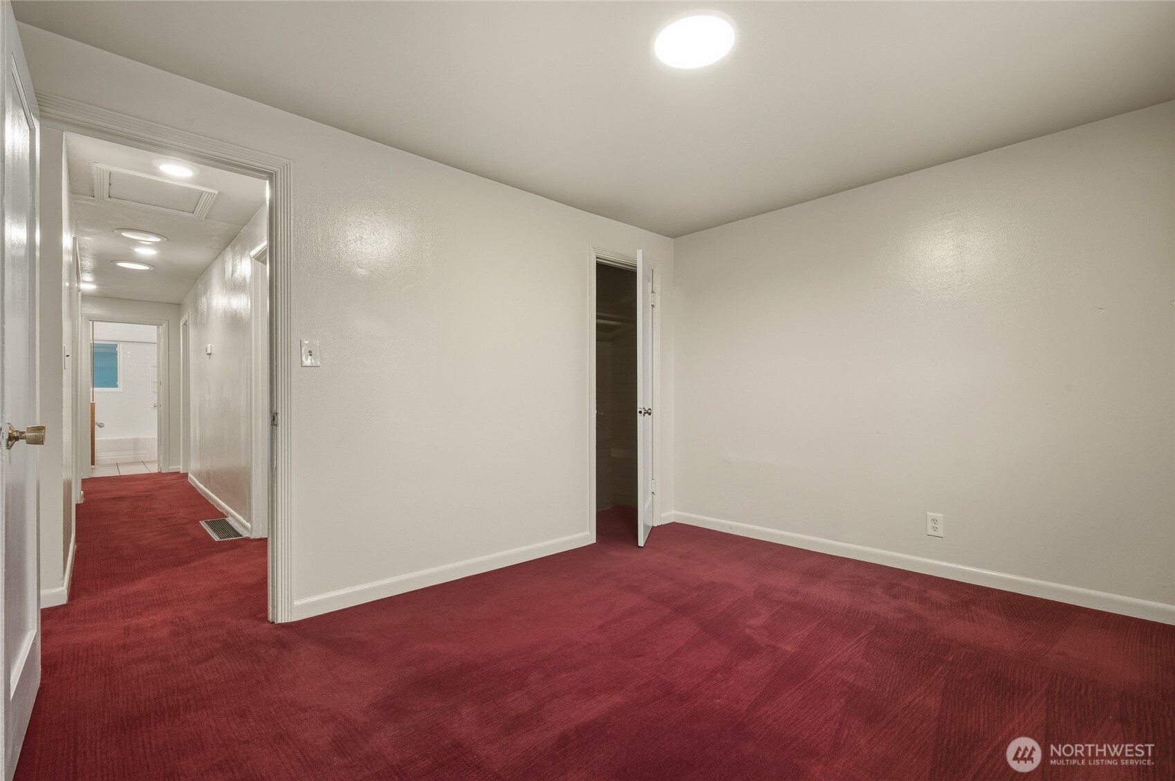 7942 15th Avenue Southwest Seattle, WA 98106 - Photo 12 of 31 an empty room with wooden floor and windows