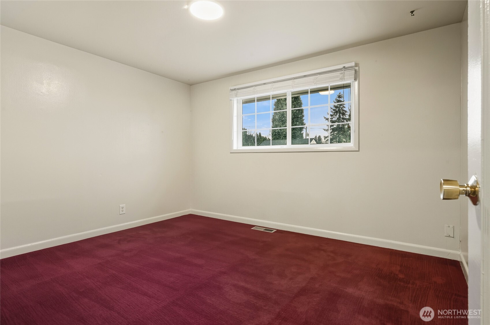 7942 15th Avenue Southwest Seattle, WA 98106 - Photo 14 of 31 an empty room with a window