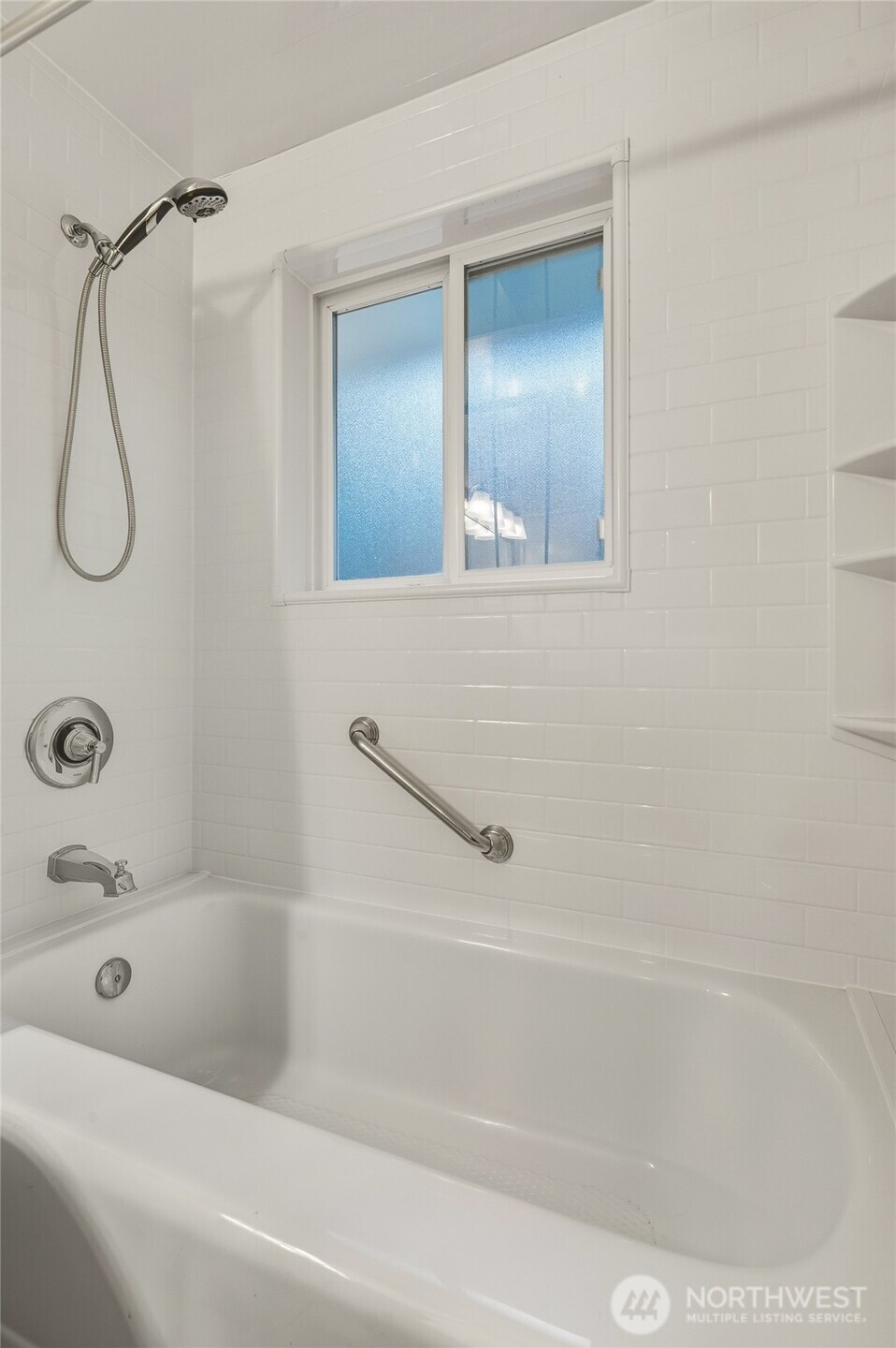7942 15th Avenue Southwest Seattle, WA 98106 - Photo 19 of 31 a bathroom with a bath tub with a shower
