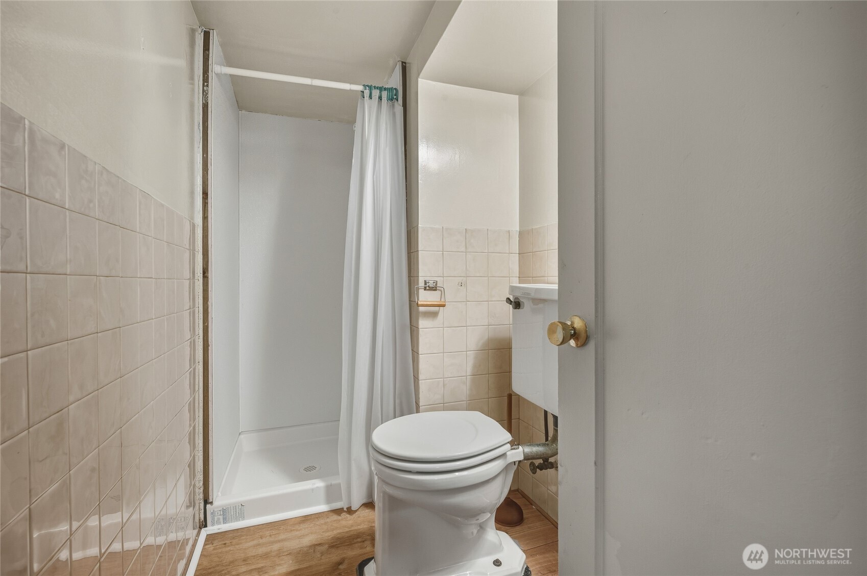 7942 15th Avenue Southwest Seattle, WA 98106 - Photo 23 of 31 a bathroom with a toilet and a shower