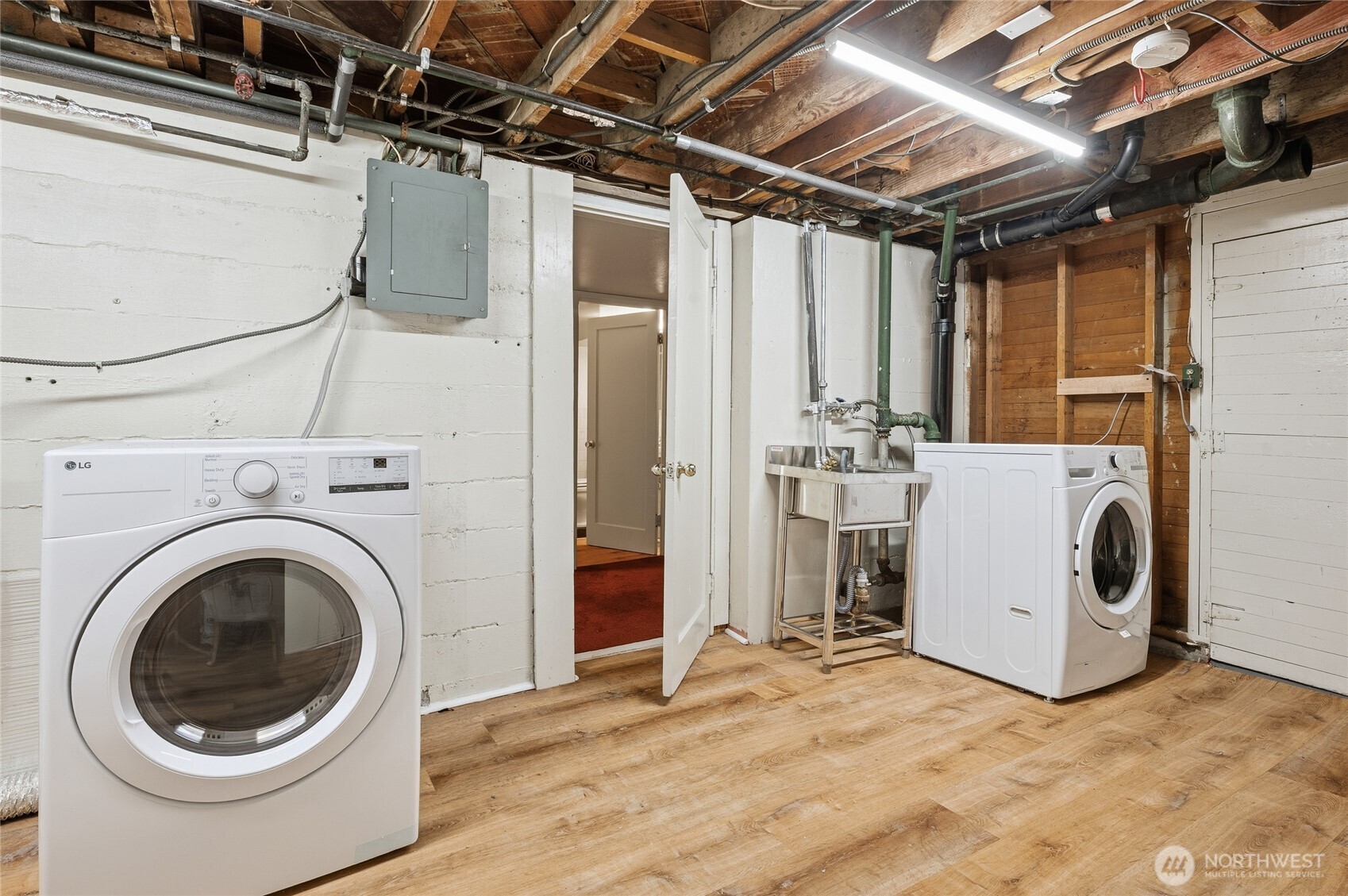 7942 15th Avenue Southwest Seattle, WA 98106 - Photo 25 of 31 a view of a storage & utility room with washer and dryer