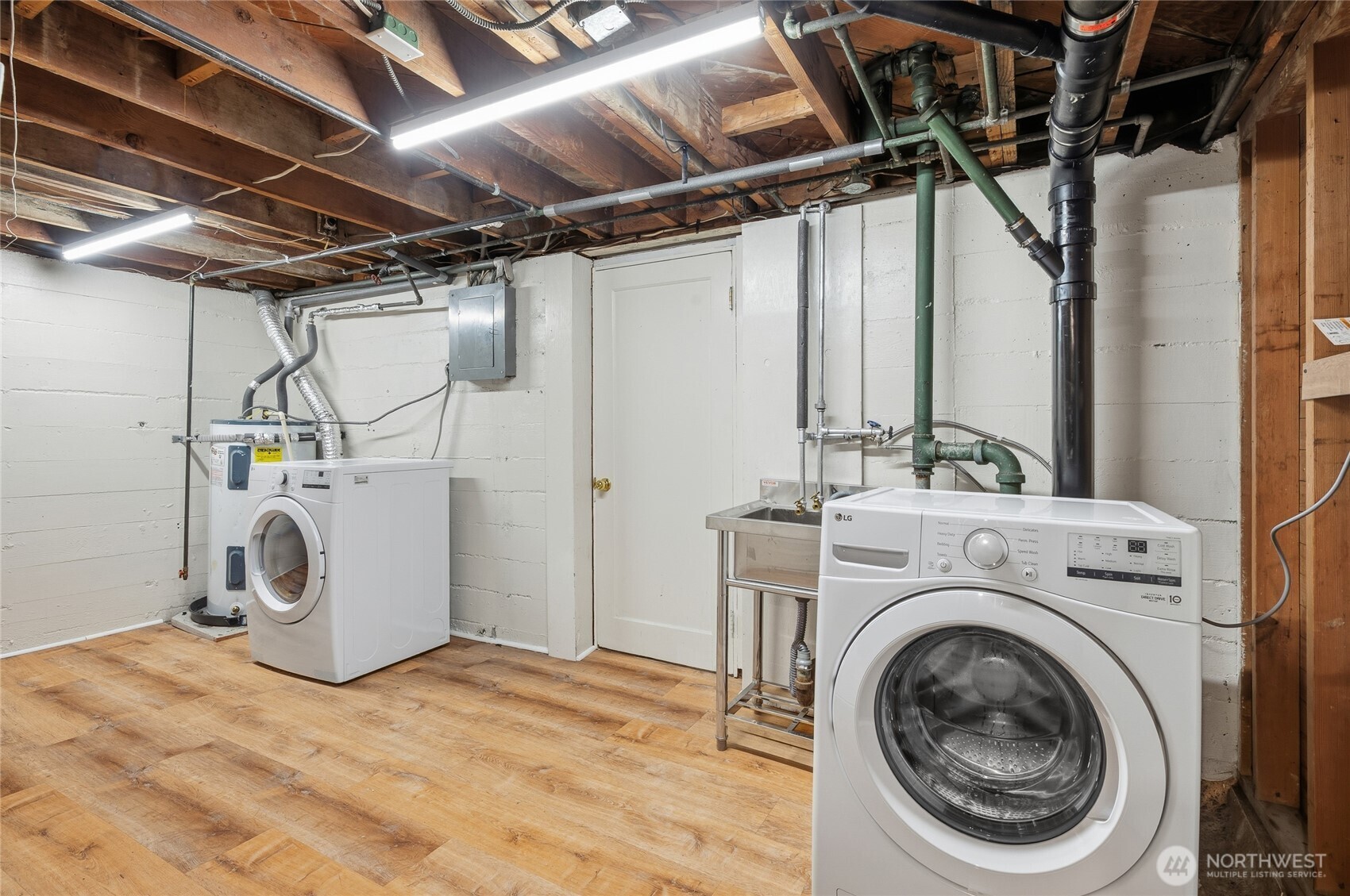 7942 15th Avenue Southwest Seattle, WA 98106 - Photo 26 of 31 a utility room with dryer and washer