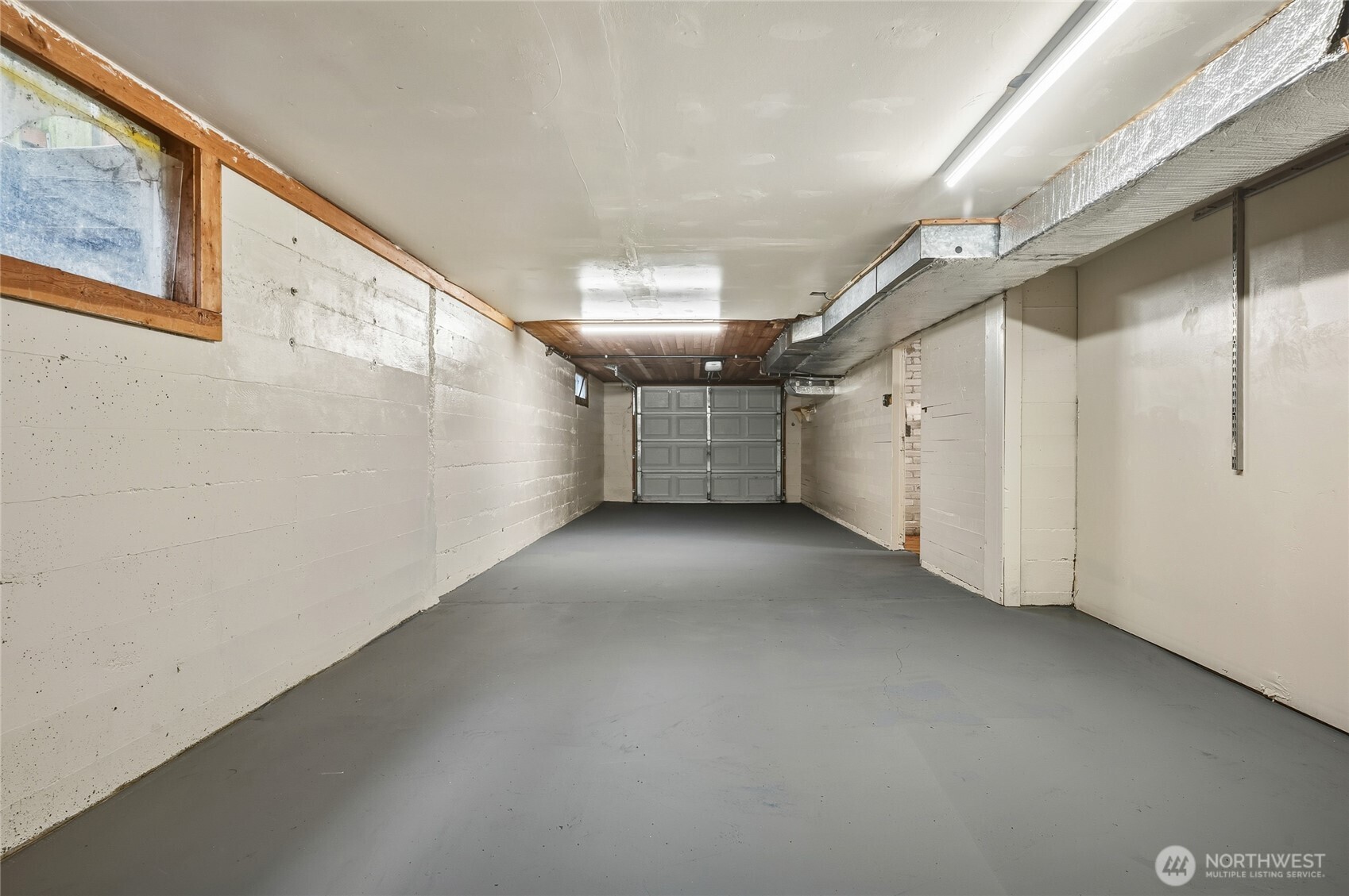 7942 15th Avenue Southwest Seattle, WA 98106 - Photo 28 of 31 a view of a big room with closet and windows