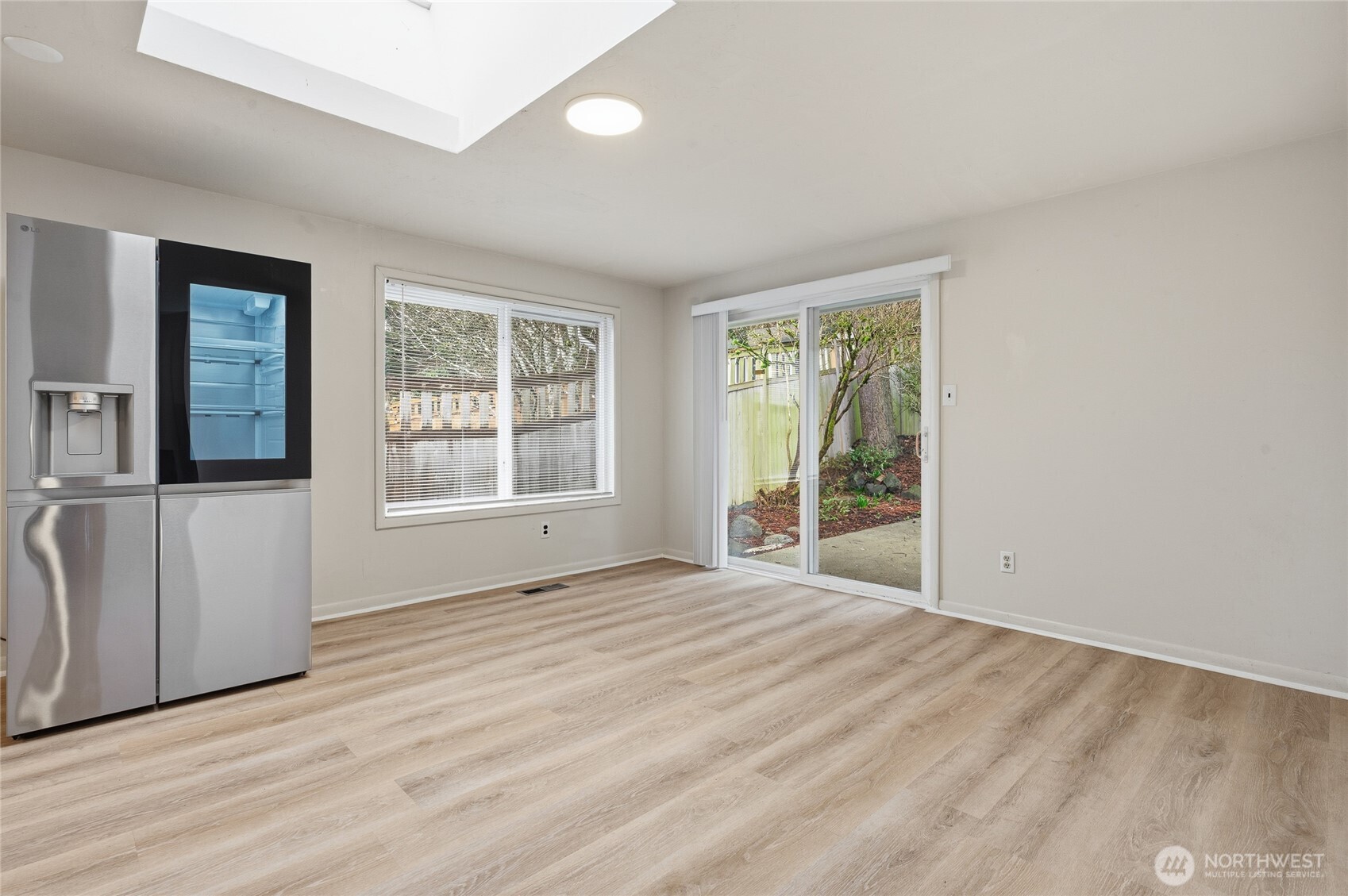 7942 15th Avenue Southwest Seattle, WA 98106 - Photo 5 of 31 a view of an empty room with a window