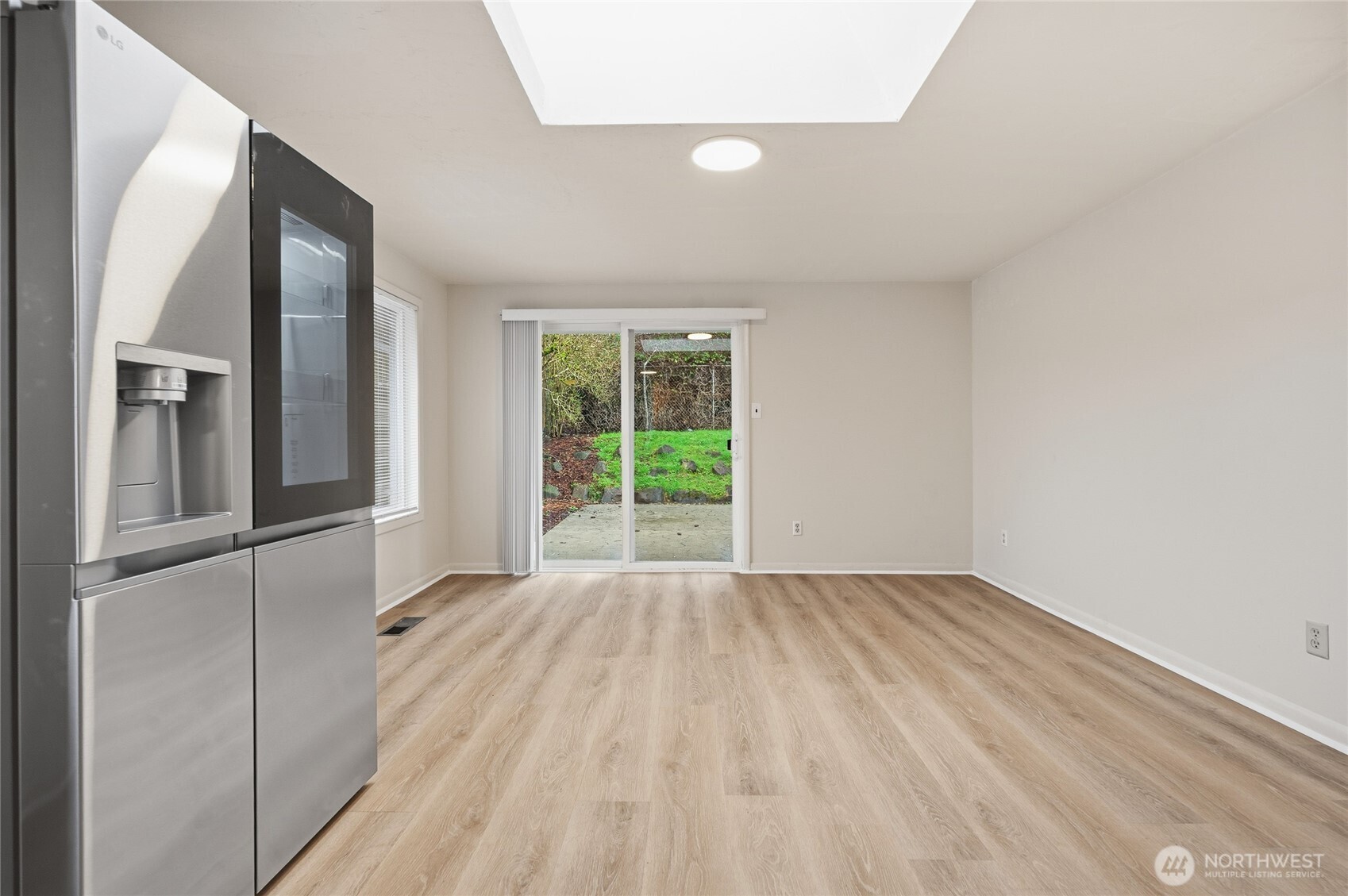 7942 15th Avenue Southwest Seattle, WA 98106 - Photo 6 of 31 a view of an empty room with a window