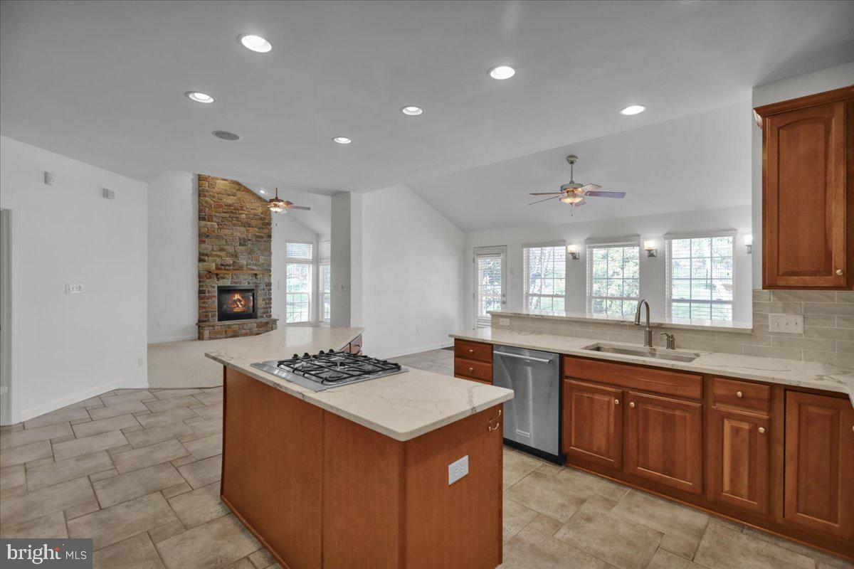12 Hidden Brook Way Reading, PA 19608 - Photo 16 of 23 a kitchen with stainless steel appliances granite countertop a sink a stove a refrigerator and a counter top space