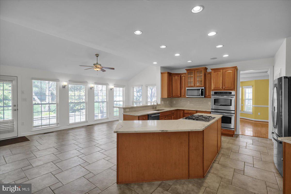 12 Hidden Brook Way Reading, PA 19608 - Photo 17 of 23 a kitchen with stainless steel appliances granite countertop a sink a stove and a refrigerator